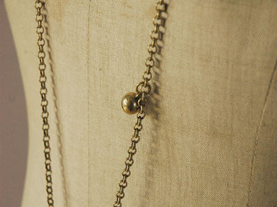 Polder / SURI purse necklace (olive mustard)